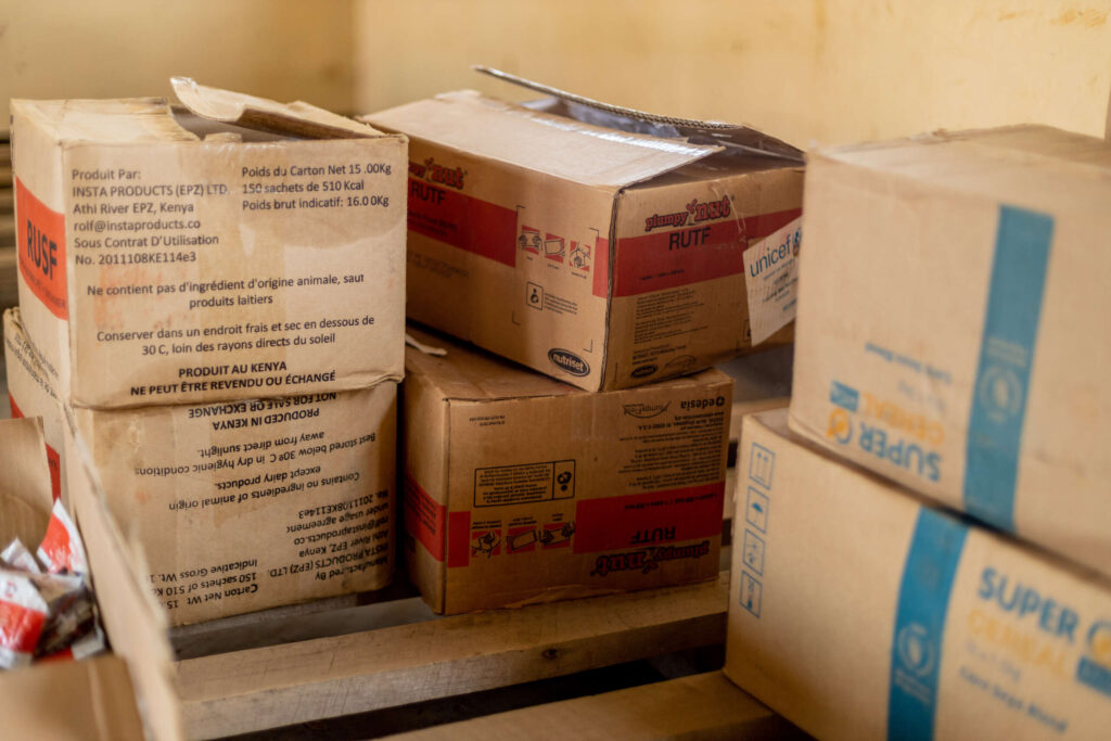 Boxes of emergency supplemental food stacked in a storage room.